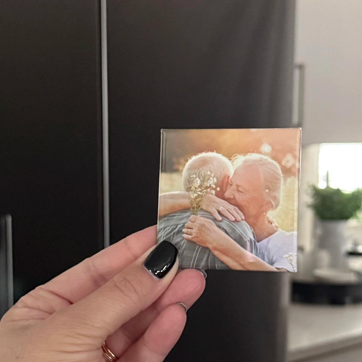 Milestone Magnets custom photo magnet of grandparents hugging in golden sunlight, a heartfelt keepsake gift for preserving family memories. 